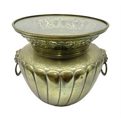 Brass jardinière with fluted rim decorated with floral sprigs, with lion mask handles, with various shells displayed inside under a glass cover, D36cm, H36cm 