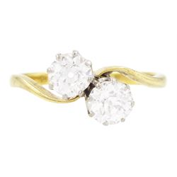 Gold diamond ring, crossover set with two old cut diamonds, stamped 18ct, total diamond we...