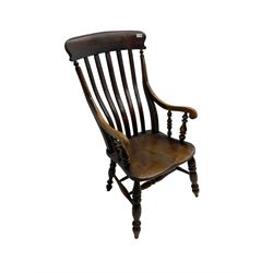 Late 19th century elm farmhouse armchair, high lath back raised on turned supports united by stretcher
