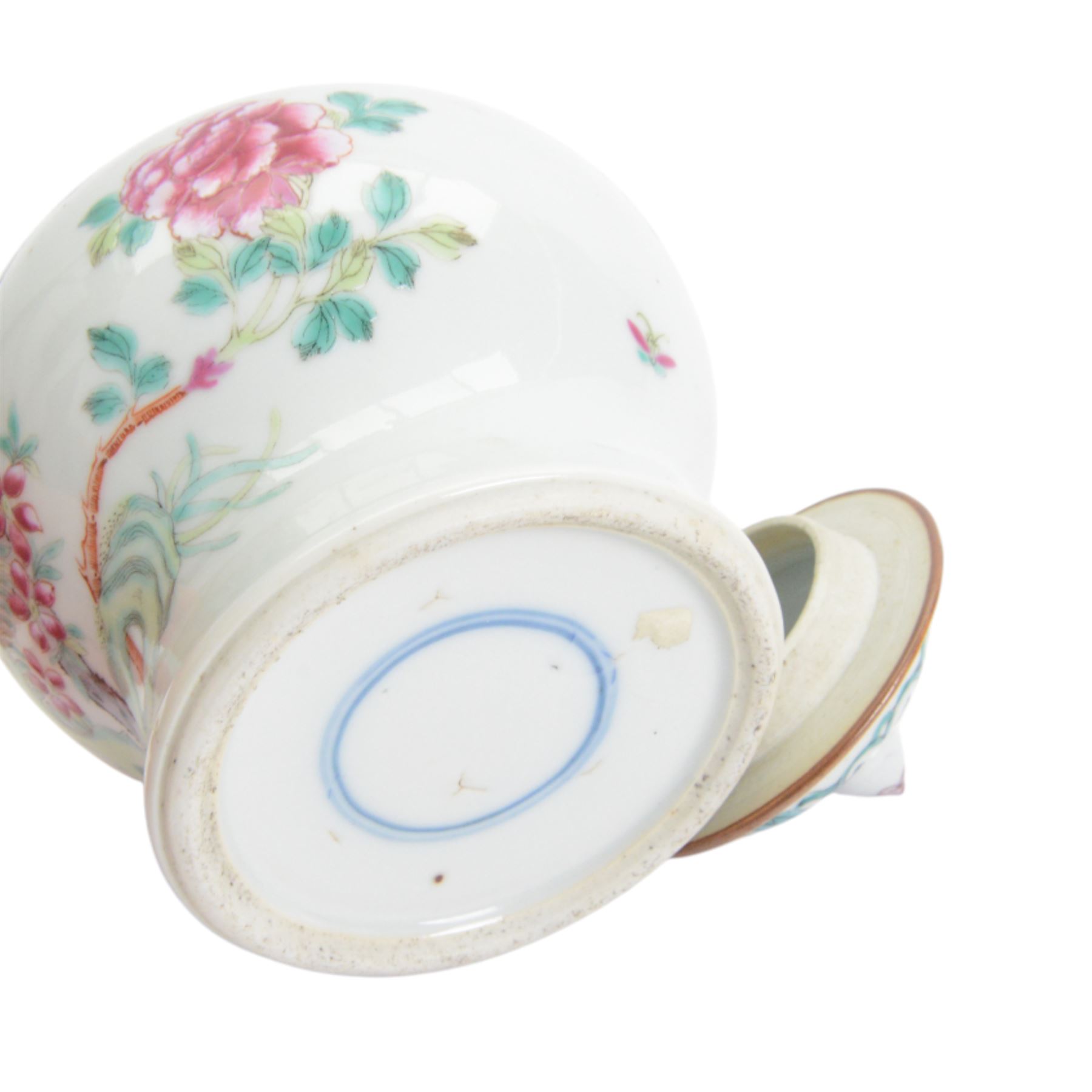 Chinese Qianlong period famille rose porcelain jar and cover, of small squat baluster form with domed cover and knop finial, finely enamelled in the famille rose palette with peony blooms, flowering prunus and bamboo issuing from pierced rockwork, upon a white glazed ground, with underglaze blue double ring mark beneath, H15cm

Provenance: From the collection of Andrew Chichester Everitt.