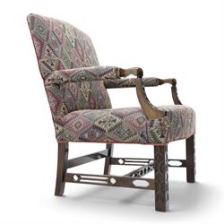 Chippendale design Gainsborough elbow chair, upholstered in kilim fabric, blind fretwork and acanthus carving
