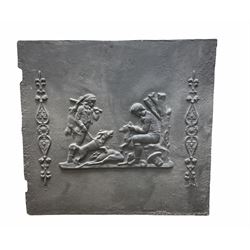 Cast iron fireback, depicting huntsmen with hounds, H51cm W54.5, together with two cast iron plaques, the first example depicting a village scene H34.5 W48cm, the second a family scene in a garden, H38cm, W60cm.  
