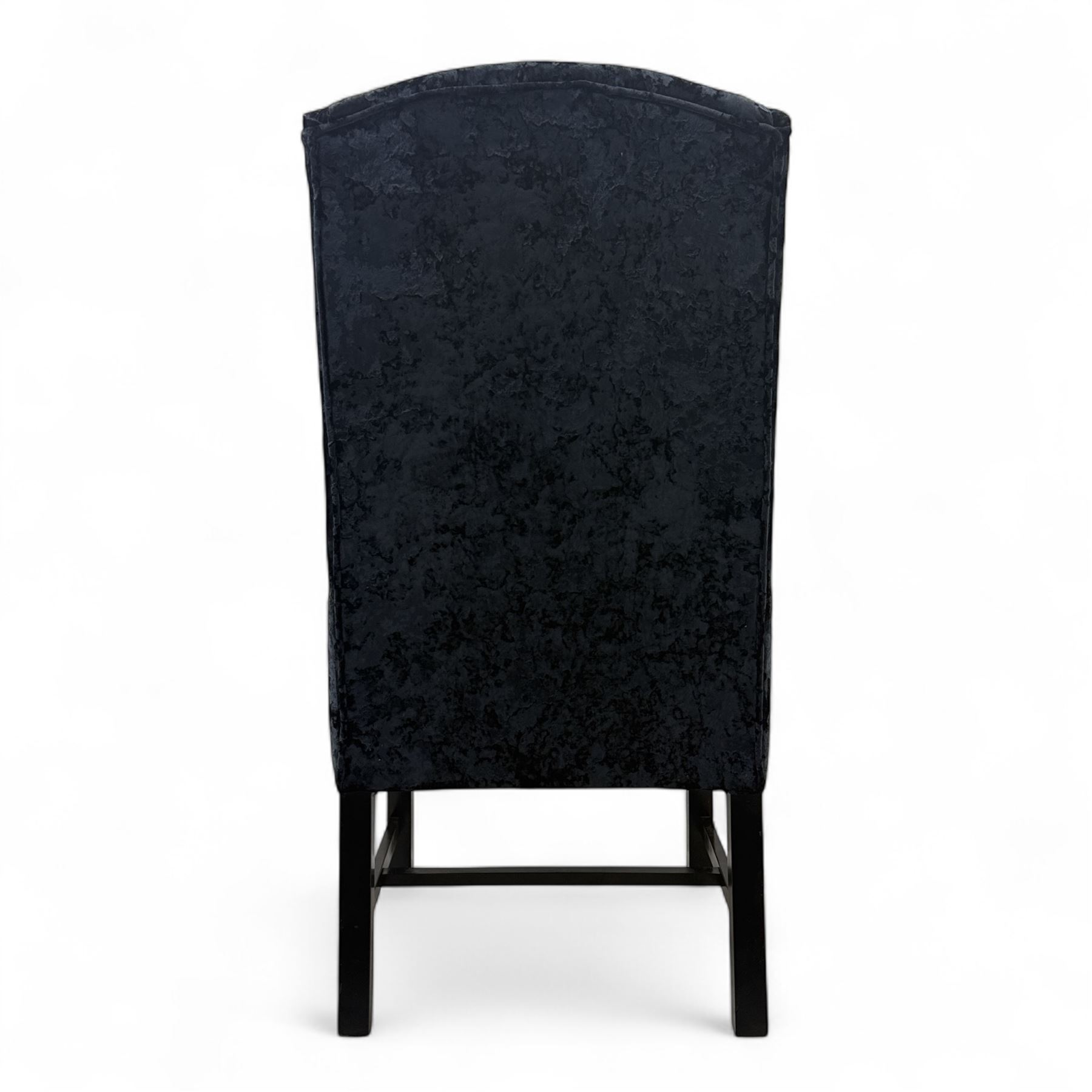 Oka - Pair of contemporary upholstered wingback armchairs, in black and blue textured velvet effect fabric, with tall scroll wing sides and square tapered legs joined by stretchers