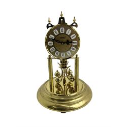 Late-20th century Haller torsion clock - German 400-day clock under an acrylic dome, with a gilt dial Roman numerals and pierced steel hands, on a circular brass plated base with pendulum lock, torsion suspension intact. with key. 