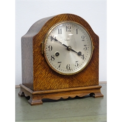  Early 20th century oak granddaughter clock, silvered dial Arabic movement enclosing a 'Smith's' electric movement (H134cm) and a oak eight day mantle clock with German movement striking on a gong (2)  