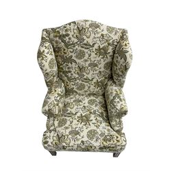 Georgian design wingback armchair, upholstered in Sanderson Mandalay fabric, on mahogany feet united by H stretcher