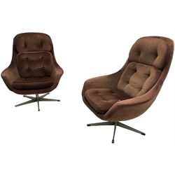 Pair of 1960s swivel armchairs with matching stool, upholstered in chocolate brown fabric, on chrome supports