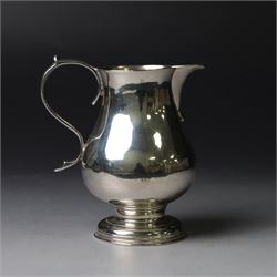 George II silver cream jug, of plain bellied form with capped scroll handle and sparrow beak, upon stepped circular foot, hallmarked London 1737, makers mark indistinct, H8.5cm
