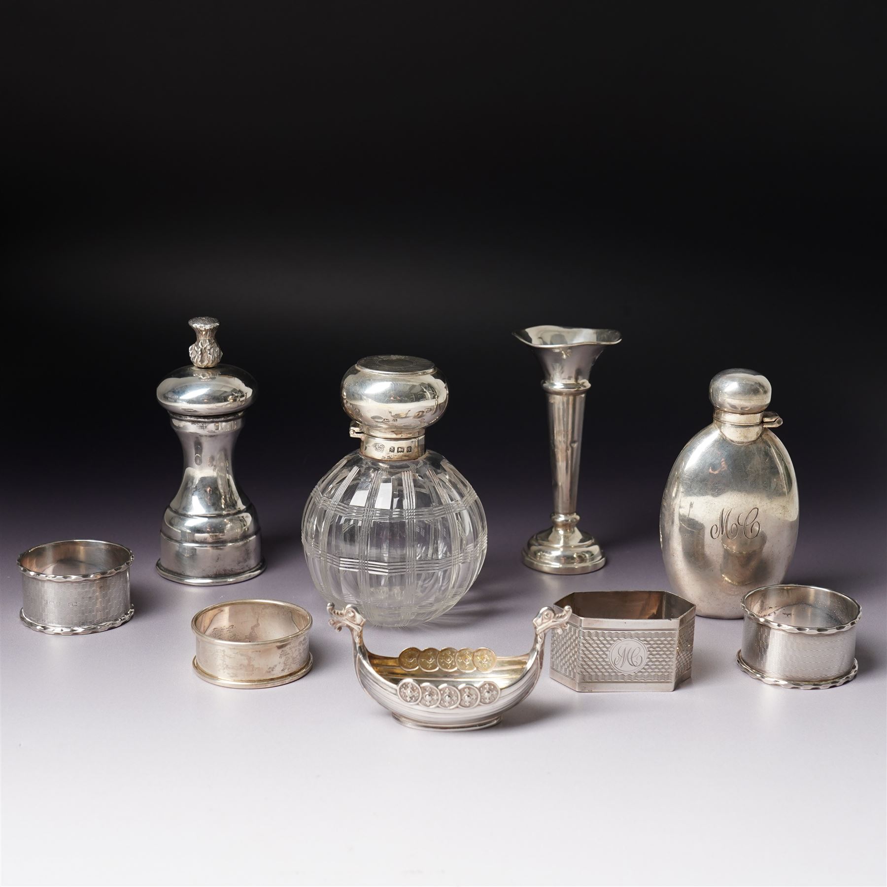 Small silver hip flask engraved with initials H9cm Sheffield 1988 Maker Hugh Crawshaw, silver pepper mill Sheffield 1975, globe scent flask with silver cover, four silver serviette rings, small silver vase and Norwegian silver salt