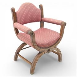 Late Victorian oak x-frame armchair, upholstered padded back and seat covered in pink patt...