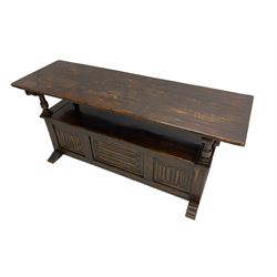 Jacobean design oak Monks bench, the front with carved linenfold panels, hinged metaphoric table back, hinged box seat compartment, on sledge feet