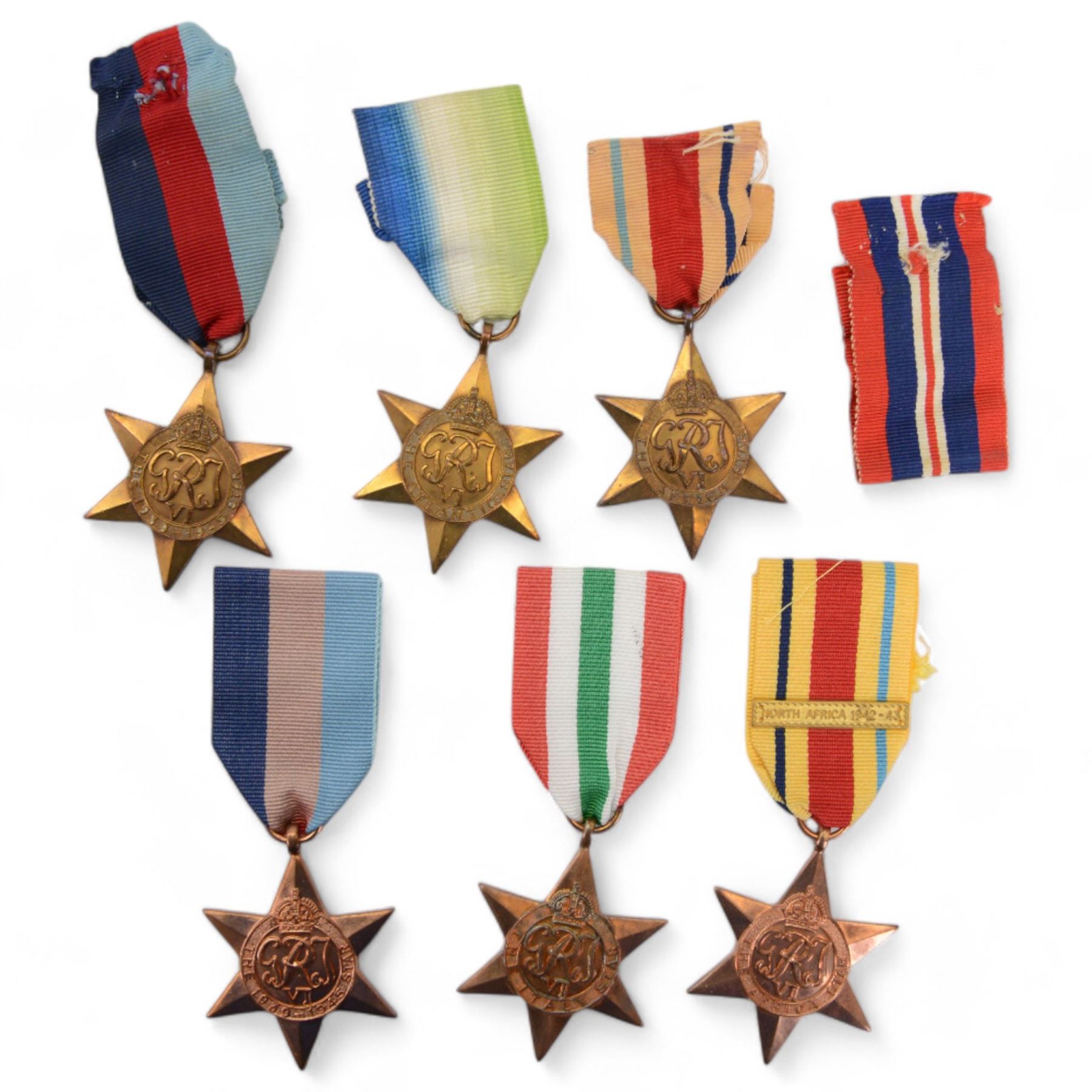 WWII group of five medals, comprising1939 -1945 War Medal, Defence Medal, Atlantic Star, Africa Star, 1939-1945 awarded to Frederick Henry Grubb, together with Missileman badge and certificate of service and WWII War Medal and three replica medals, together with certificate of service for Walter Barnes 