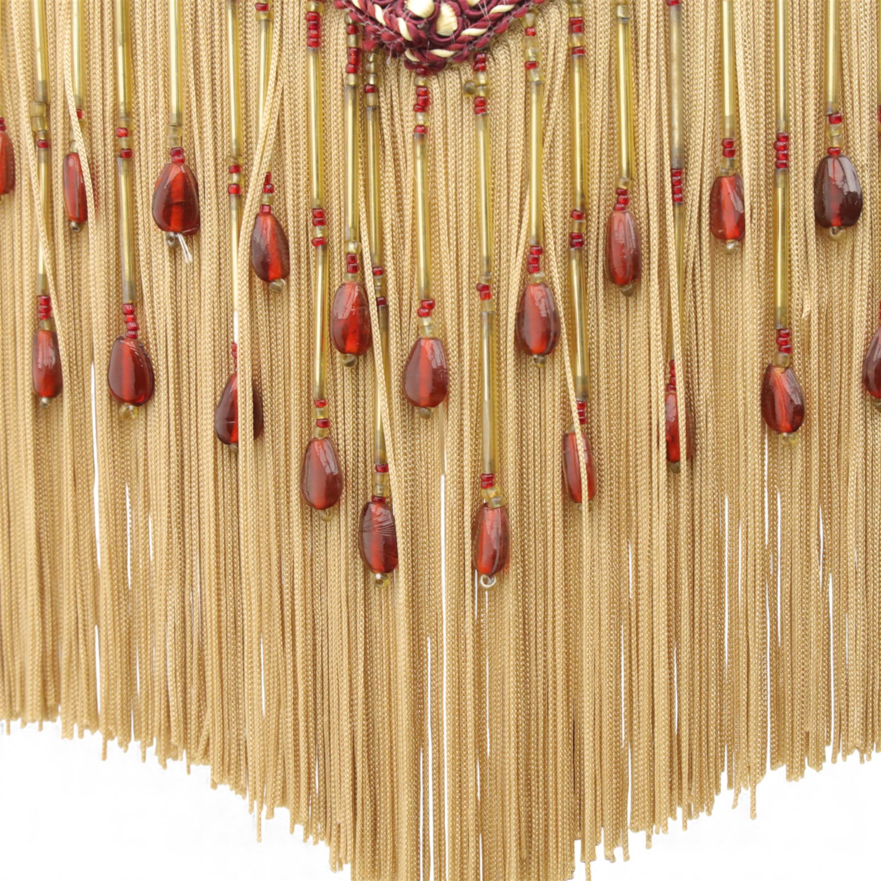 Early 20th century mahogany standard lamp, the turned column raised on a circular stepped base with compressed bun feet, fitted with a shaped Downton Abbey silk shade decorated with foliate trail motifs, beaded edging and fringe trim