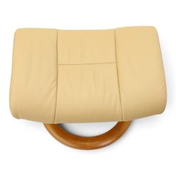 Ekornes Stressless - beech framed reclining swivel armchair with matching footstool, on U-shaped supports with circular bases, upholstered in beige leather