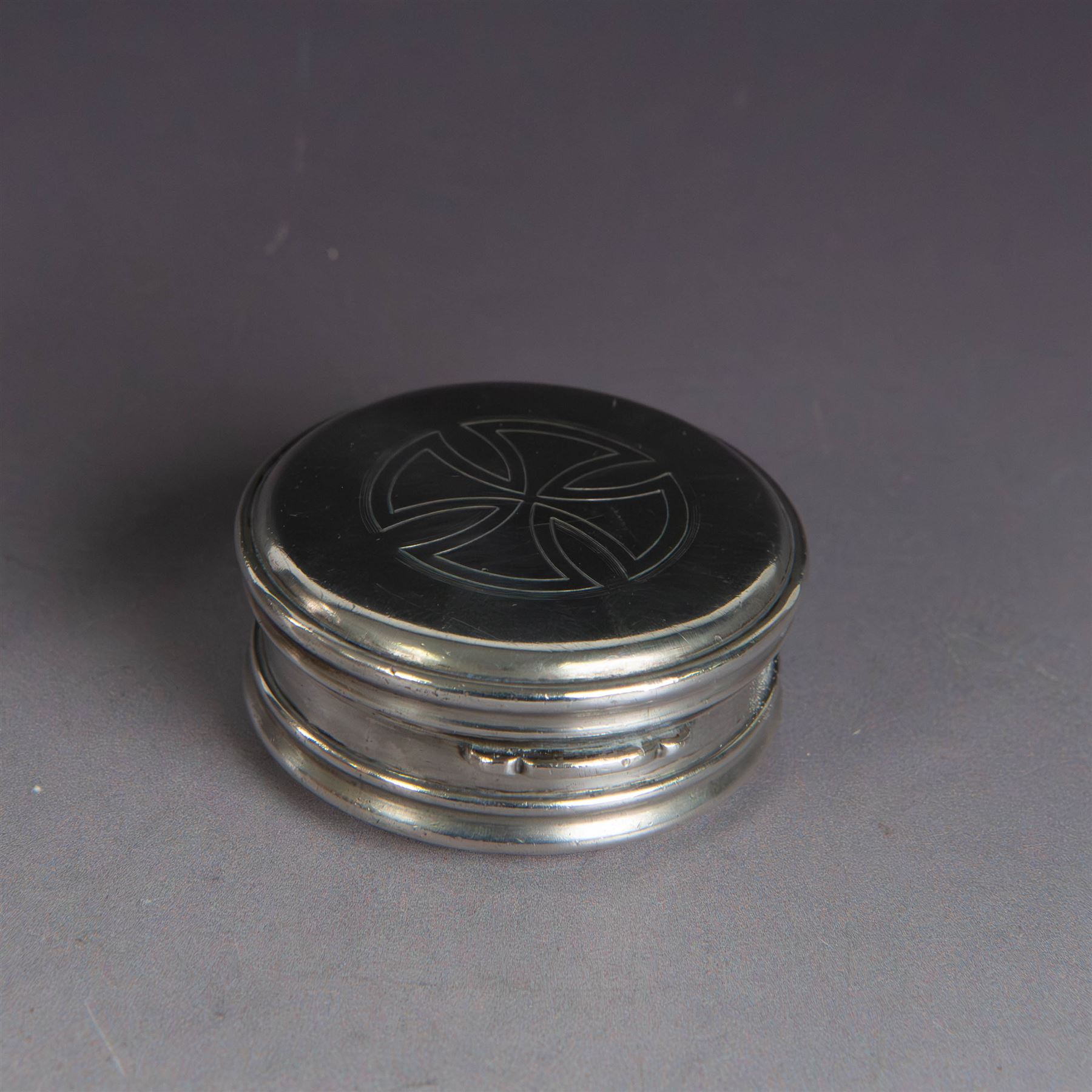 Late Victorian silver jar with cover, of cylindrical form with  domed cover engraved with initials, hallmarked Charles & George Asprey, together with a small ecclesiastical trinket box, engraved with cross to cover and with personal engraving beneath, hallmarked Edgar Ernest Davis, London 1944, taller jar H6cm