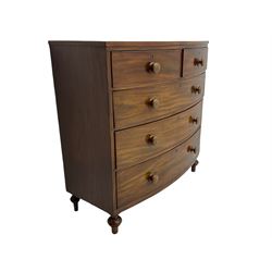 Early 19th century mahogany bow front chest, fitted with two short and three long drawers, turned feet