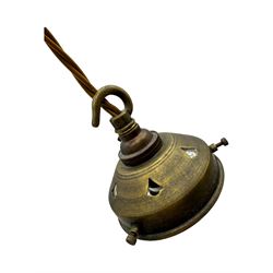 Set of two small and two large pendant lights, each with clear glass spherical shade with moulded swirl pattern, suspended from twisted cords, brass ceiling rose