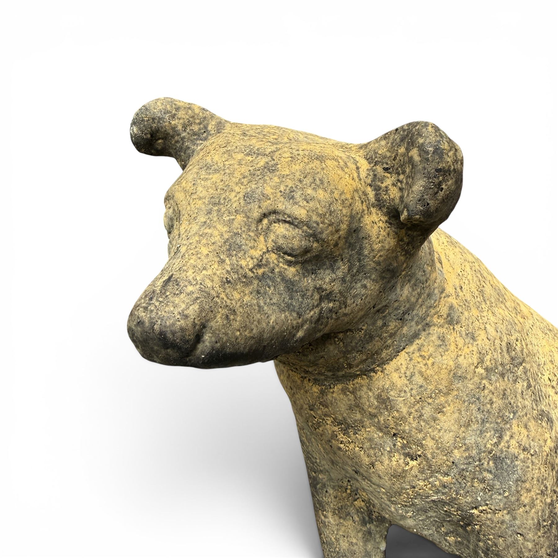 Cast stone garden statue in the form of a seated Jack Russell Terrier on a rectangular base