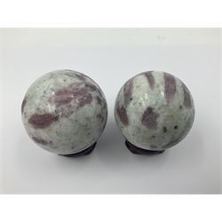 Pair of pink tourmaline spheres, upon gilt metal stands, H9cm D5cm