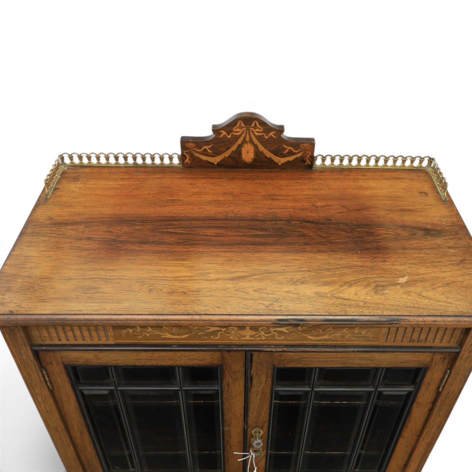 Druce & Co - Edwardian inlaid cabinet, galleried topwith inlay and brass galleried top, inlaid frieze above twin bevel glazed doors revealing a shelved interior, the lower section with fall front cupboard