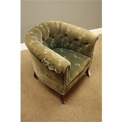  Edwardian tub shaped armchair, beech framed with sprung seat and buttoned back, square tapering supports with spade feet, brass castors  