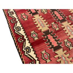 Large  red ground Kilim rug or wall hanging, decorated with geometric patterns and dated within the weave '1969'
