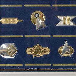 Franklin Mint The Official Star Trek Insignia Collection, set of twelve sterling silver insignia with gold plated decoration, all stamped 925 sterling with certificates of authenticity, contained within a wooden glazed display case, case H56cm