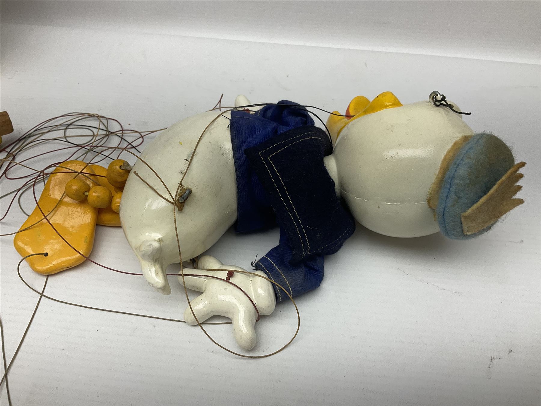 Two Pelham Puppets - The Magic Roundabout Mr. Rusty pole puppet with wool hands and blue  coat dated 1963; boxed; and Type SL Disney Donald Duck; unboxed (2)