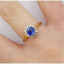 Gold oval sapphire and round brilliant cut diamond cluster ring, sapphire approx 1.05 carat