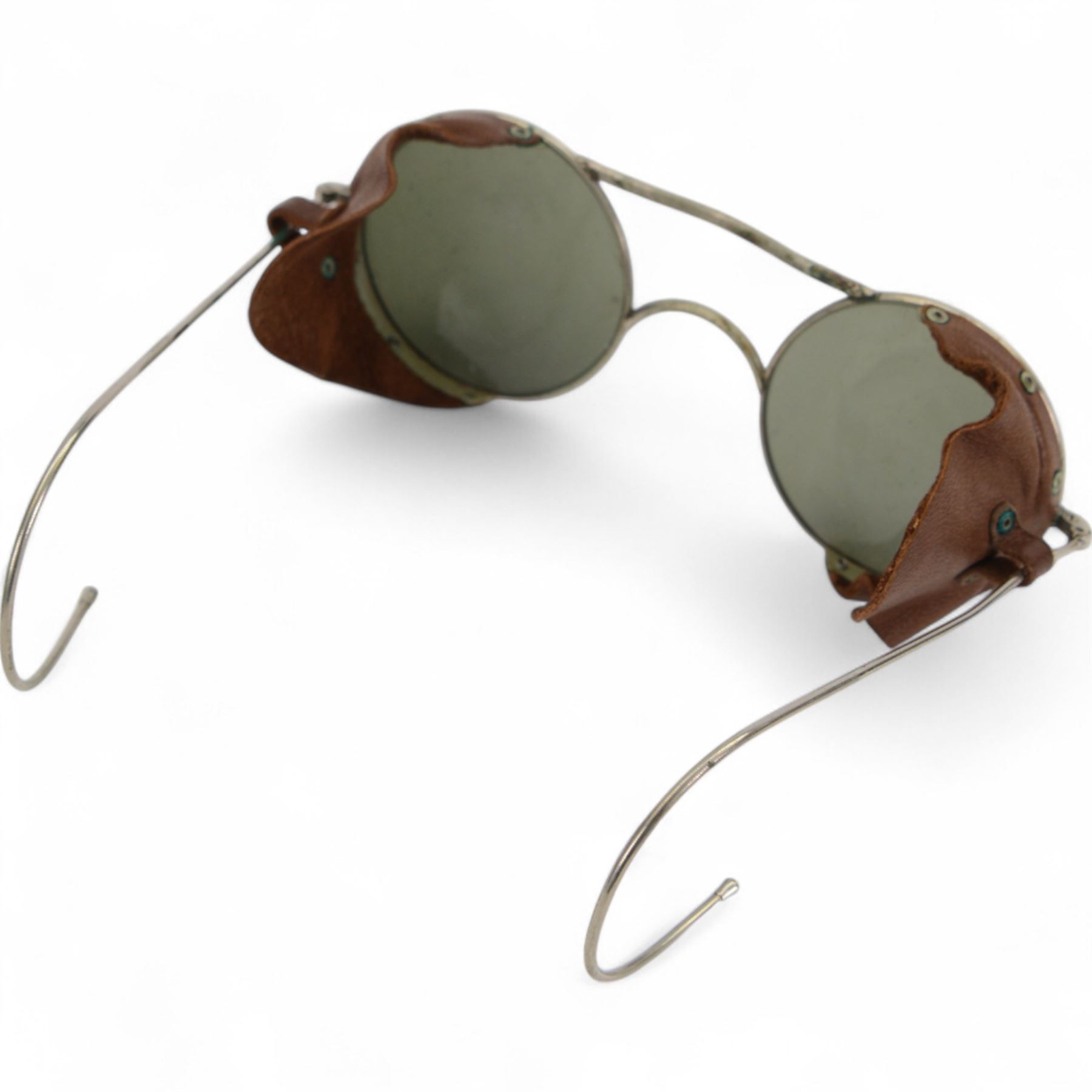 Pair of WWII British RAF Royal Air Force pilots sunglasses with leather side shields and tinted lenses, in the original Air Ministry issued tin