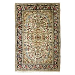 Central Persian Kashan hand-knotted carpet, ivory ground, with an all-over floral field ce...