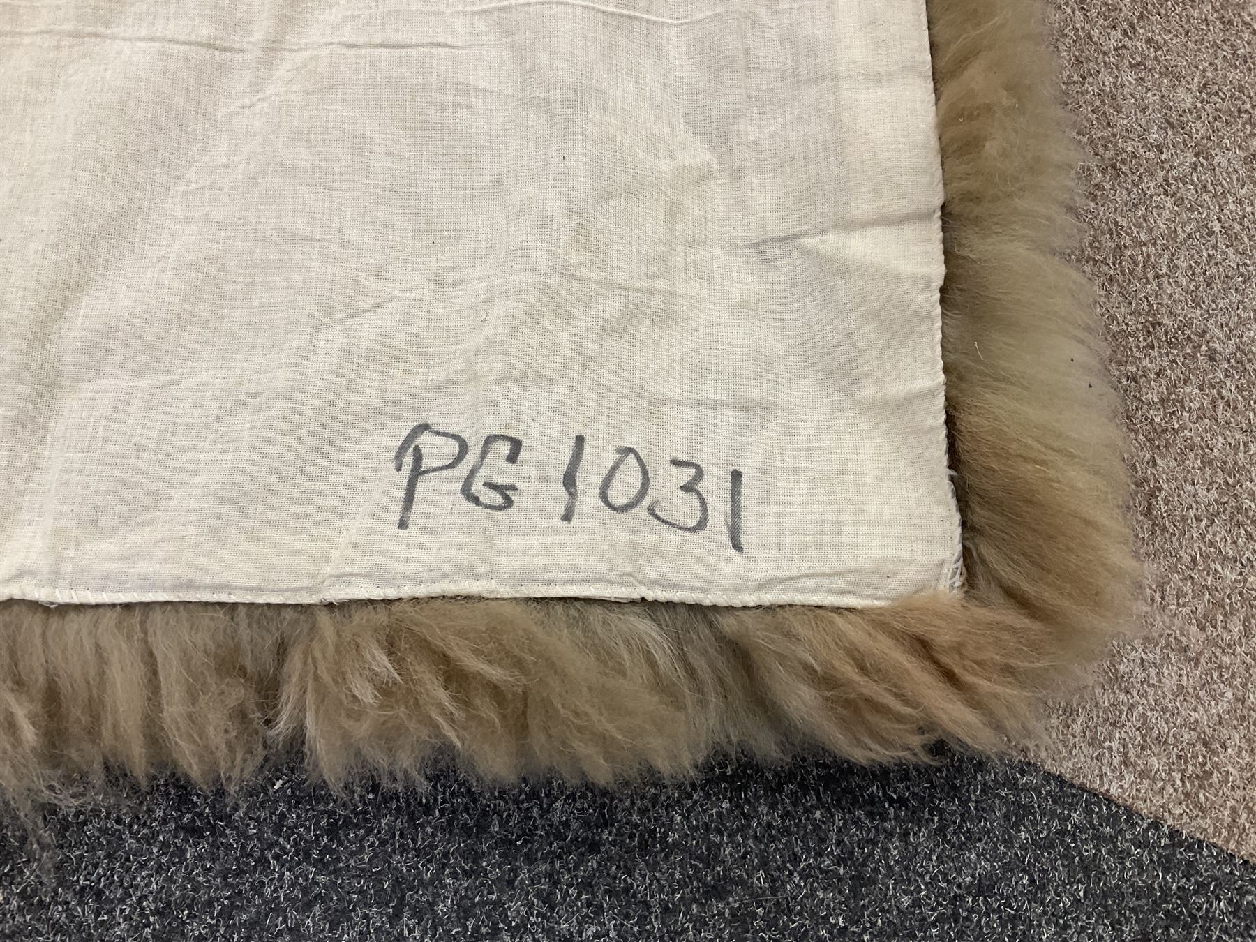 Alpaca rug/wall hanging depicting a gorilla on a cream background 