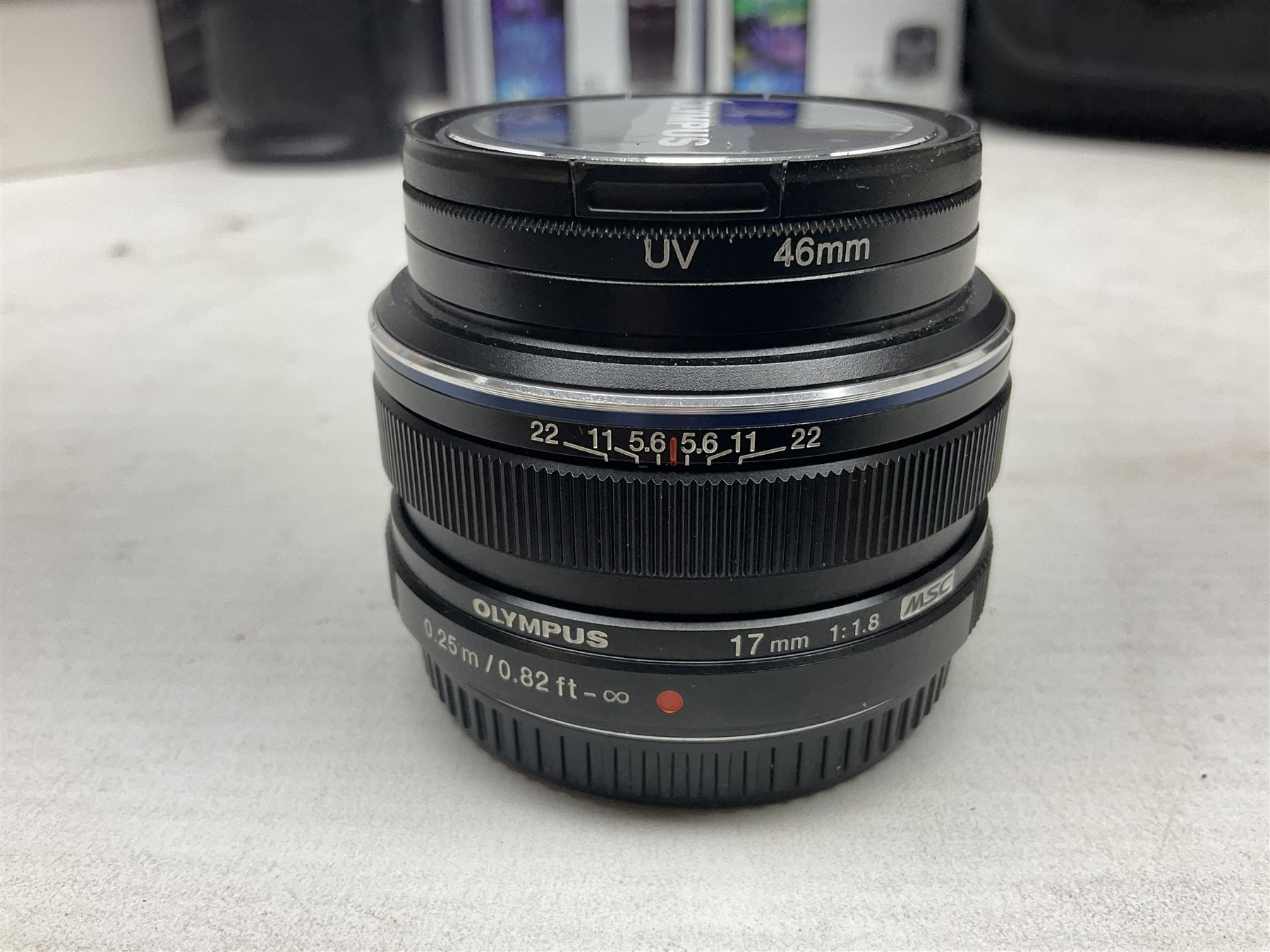 Olympus PEN-F camera body, with 'Olympus M- Zuiko Digital 25mm 1: 1.8' lens,  'Olympus M- Zuiko Digital 75-300mm 1: 4.8 - 6.7' lens and  'Olympus M- Zuiko Digital 17mm 1: 1.8' lens, with original box, together with Lowepro camera bag