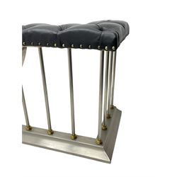 Brushed steel and brass club fire fender, upholstered corner seats in studded leather, the balustrade with lower lobed brass collars, on moulded skirt 