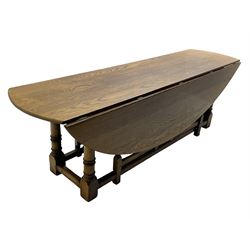 Large 18th century design oak wake or dining table, oval drop-leaf top, turned supports with double gate-leg action base, united by moulded stretchers 