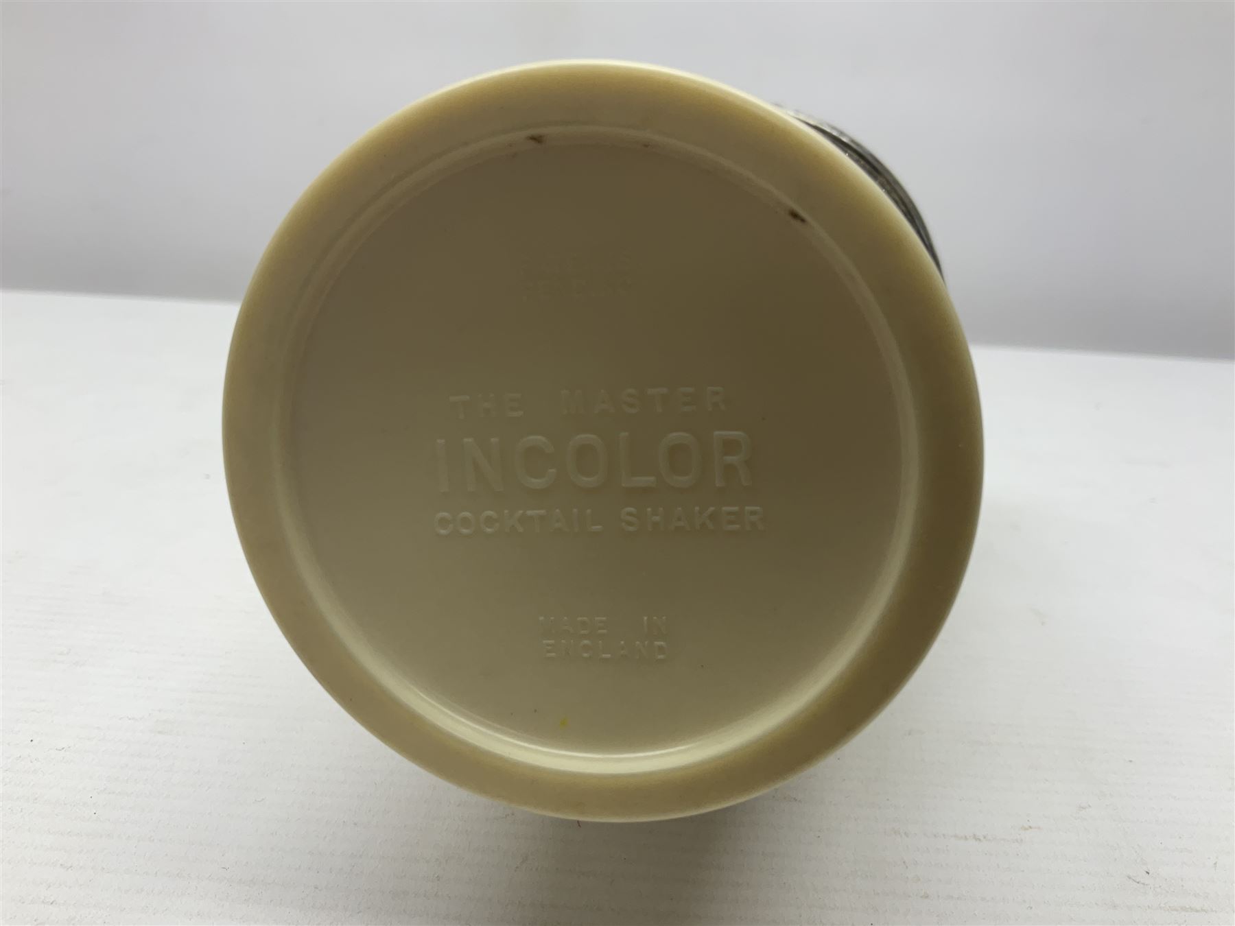 Art Deco 'The Master Incolor' cocktail shaker, in cream Bakelite and silver-plated, with a swivel panel in the cover revealing cocktail recipes, with makers mark beneath, H28cm