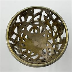 Modern silver limited edition Easter egg, no. 70/500, the gilt openwork body decorated with daffodils and detachable cover with pierced circular panel set with a single faceted blue stone, opening to reveal a gilt interior, upon silver stand with three scrolling pad feet, each hallmarked St James House Company, London 1980, height including stand 8cm