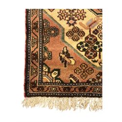 Persian design ivory ground rug, pale rose floral medallion with surrounding foliate decoration