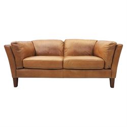 Two seat sofa upholstered in tan leather