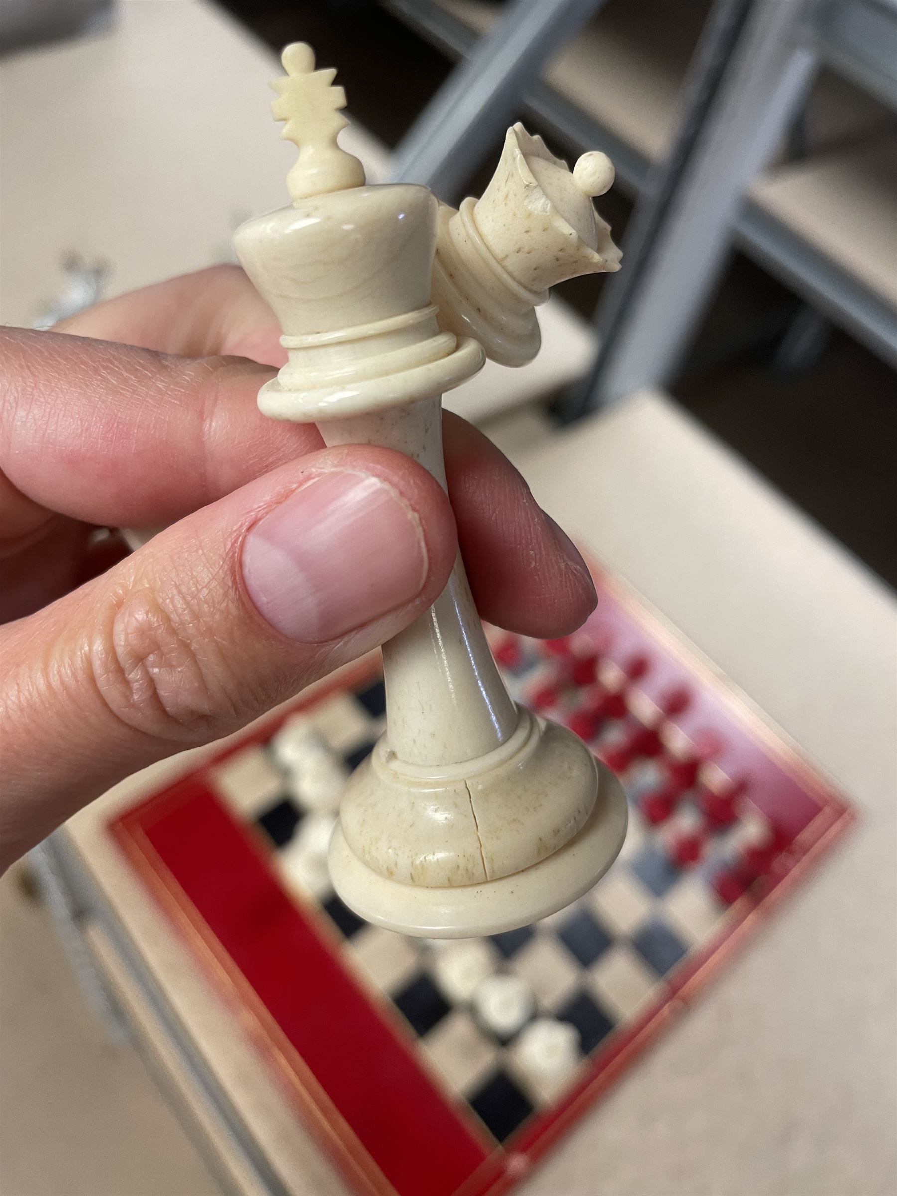 19th century walnut and brass bound games compendium box, painted to enhance the grain, of rectangular form, the hinged opening cover with rounded sides, central brass cartouche with engraved lion crest, and brass riveted straps, opening to reveal a red leather and blue silk lined compartmented interior, with fold-down games board, and lift-out tray containing playing cards, ebony turned dice towers, white and red stained bone draughts, and chess pieces, ivory dice, and ivory and ebony whist markers, and brass bezique board, cribbage board and markers, H15cm W32cm D24cm
This lot has been registered for sale under Section 10 of the APHA Ivory Act