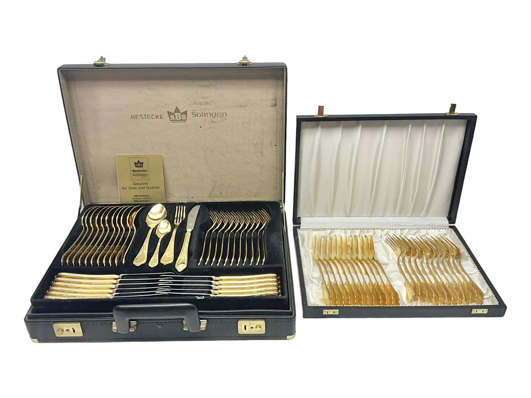 Bestecke Solingen canteen of gold plated cutlery for twelve place settings, including ladle, cake slice and serving spoons, contained within a briefcase, together with a matching set twelve of Bestecke Solingen gold plated fish knives and forks, in fitted case 