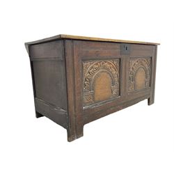 Jacobean Revival - 19th century oak blanket chest, rectangular hinged top, the two front panels carved arched foliate decoration, raised on stile supports