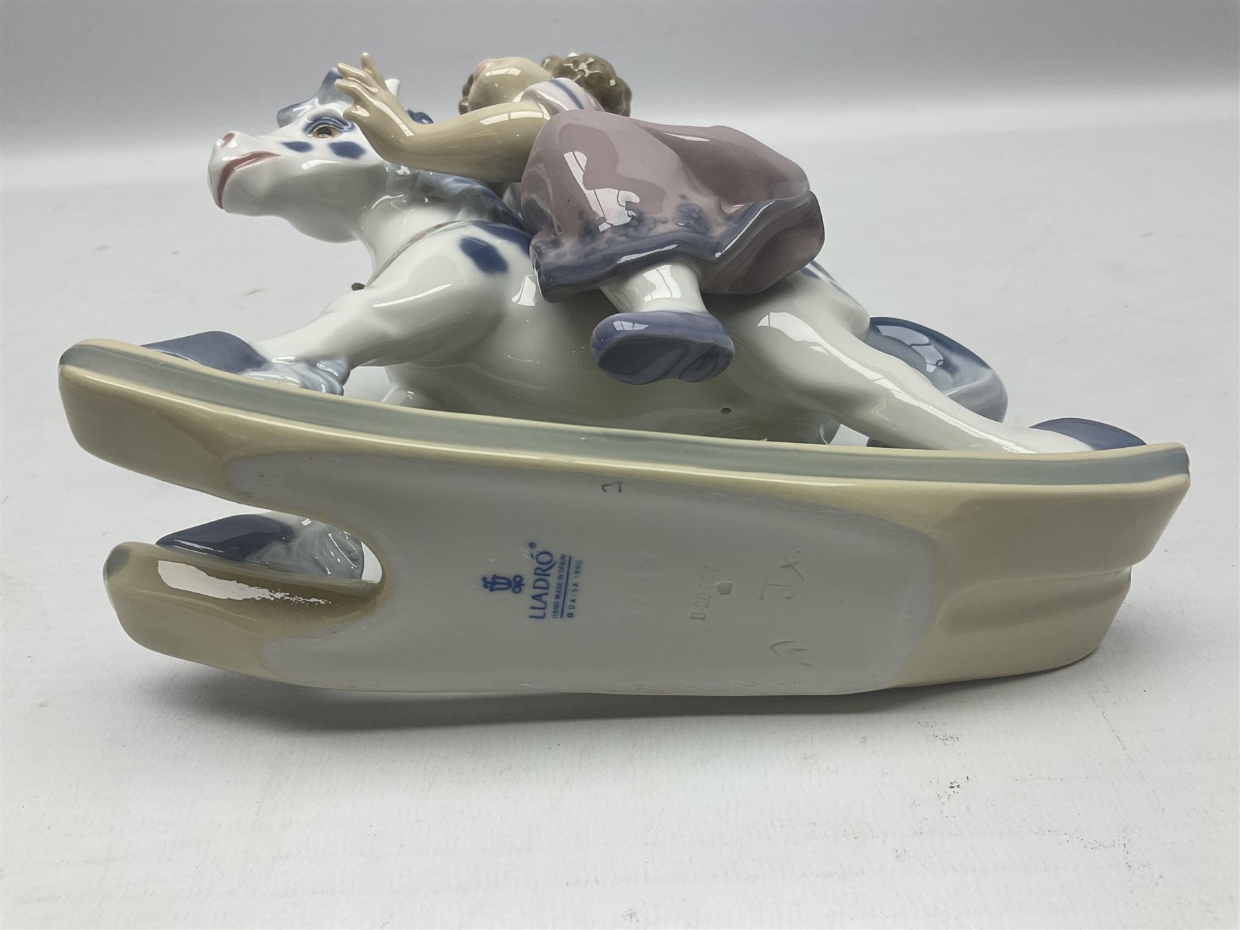 Three Lladro figures, Faithful Steed no 5769, Best Foot Forward no 5738 and Lambkins no 5469, all with original boxes, largest example H21cm 