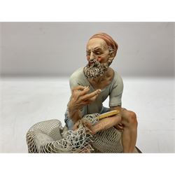 Six Capodimonte figures, comprising the first example modelled as a fisherman with a net on naturalistic rocky base, the second modelled as an elderly gentleman seated at a desk writing in a book with a quill, the third modelled as a watchmaker, another modelled as a seated tramp on a bench, another as a gentleman sat beside a tree stump hammering, and a figure group of a gentleman and lady with a mirror