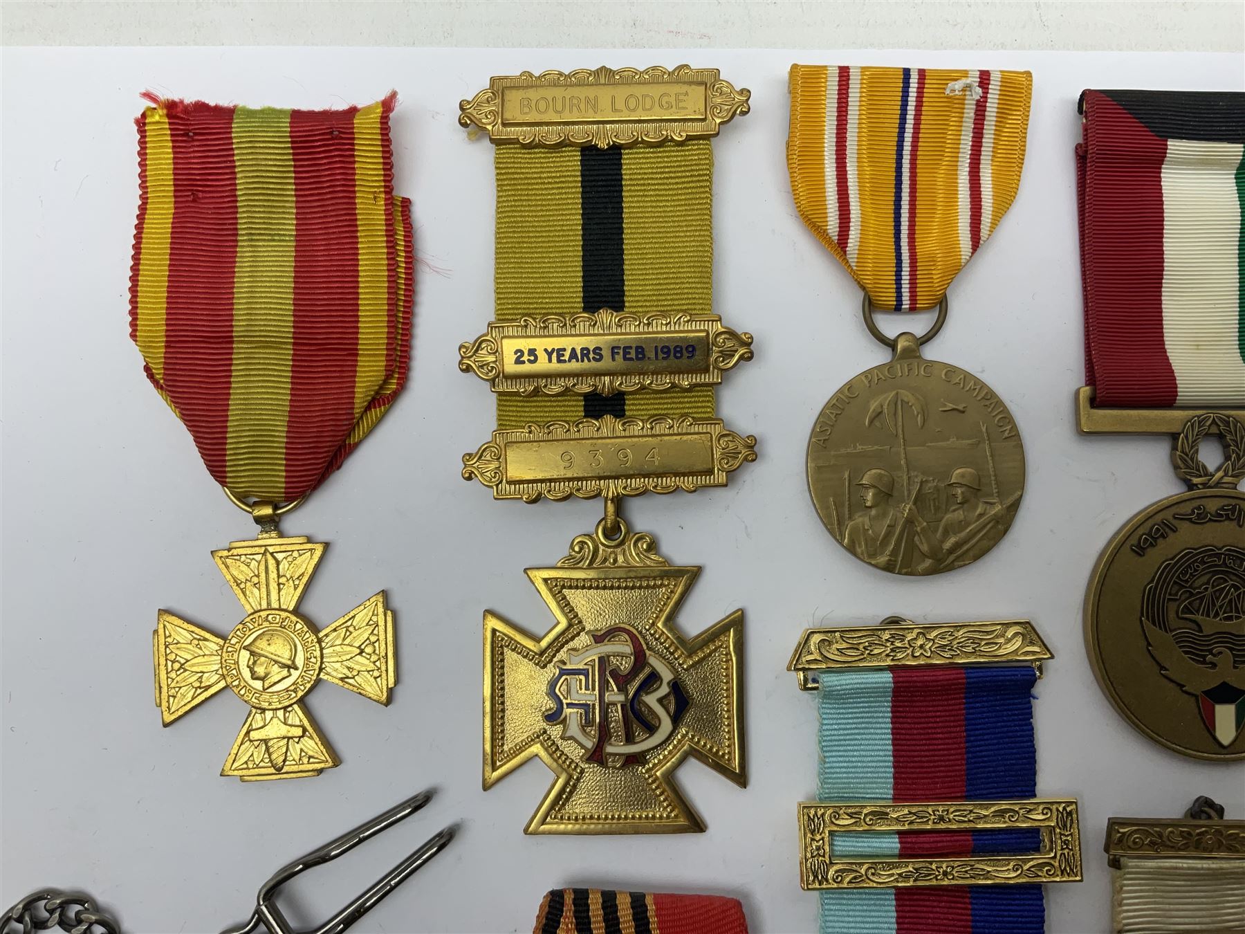 RAOB jewel Bourn Lodge 9394 with 25 years bar; two masonic jewels and triangular pendant watch; British Iron Cross style propaganda medallion; French Legion of Honour and Combatants Cross; and three foreign medals
