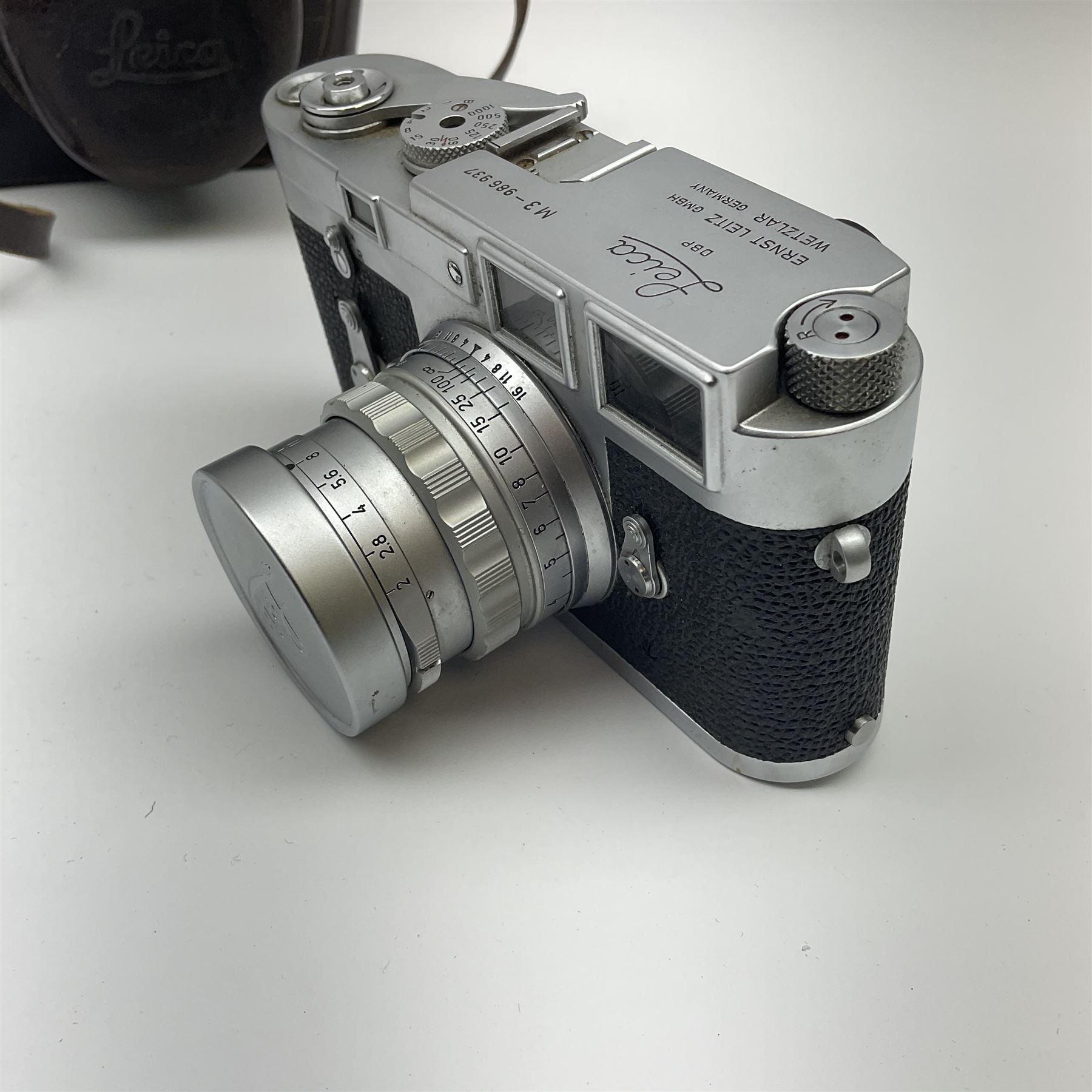 Leica M3 camera body, 1959, chrome finish, serial number '986937', fitted with 'Ernst Leitz GmbH Wetzlar Summicron f=5cm 1:2 Nr.1592614' lens, with Leica M3 instruction booklet
