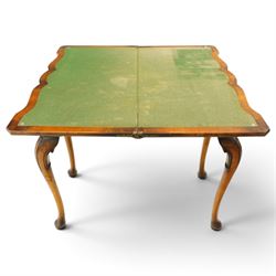 Quality early 20th century Queen Anne design walnut card table, rectangular book-matched veneer fold-over and swivel top with scalloped edge enclosing baize-lined interior, fitted with shaped frieze drawer with brass pear-drop handles over shaped apron, raised on C-scroll carved cabriole supports with pad feet