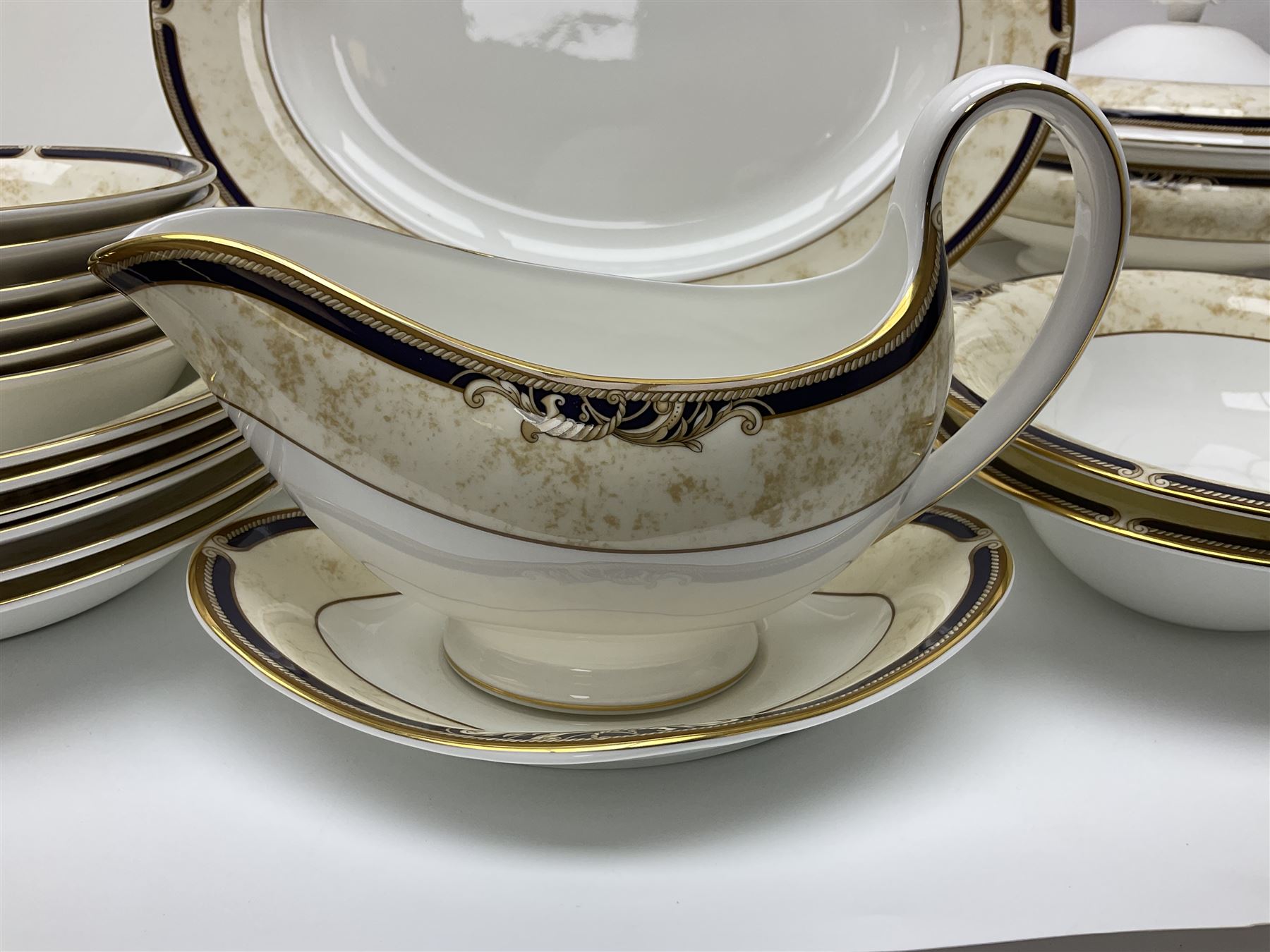 Wedgwood Cornucopia part dinner service, comprising six dinner plates, six soup bowls, six bowls, two serving platters, two oval dishes, covered serving dish, sauce boat and saucer (25)
