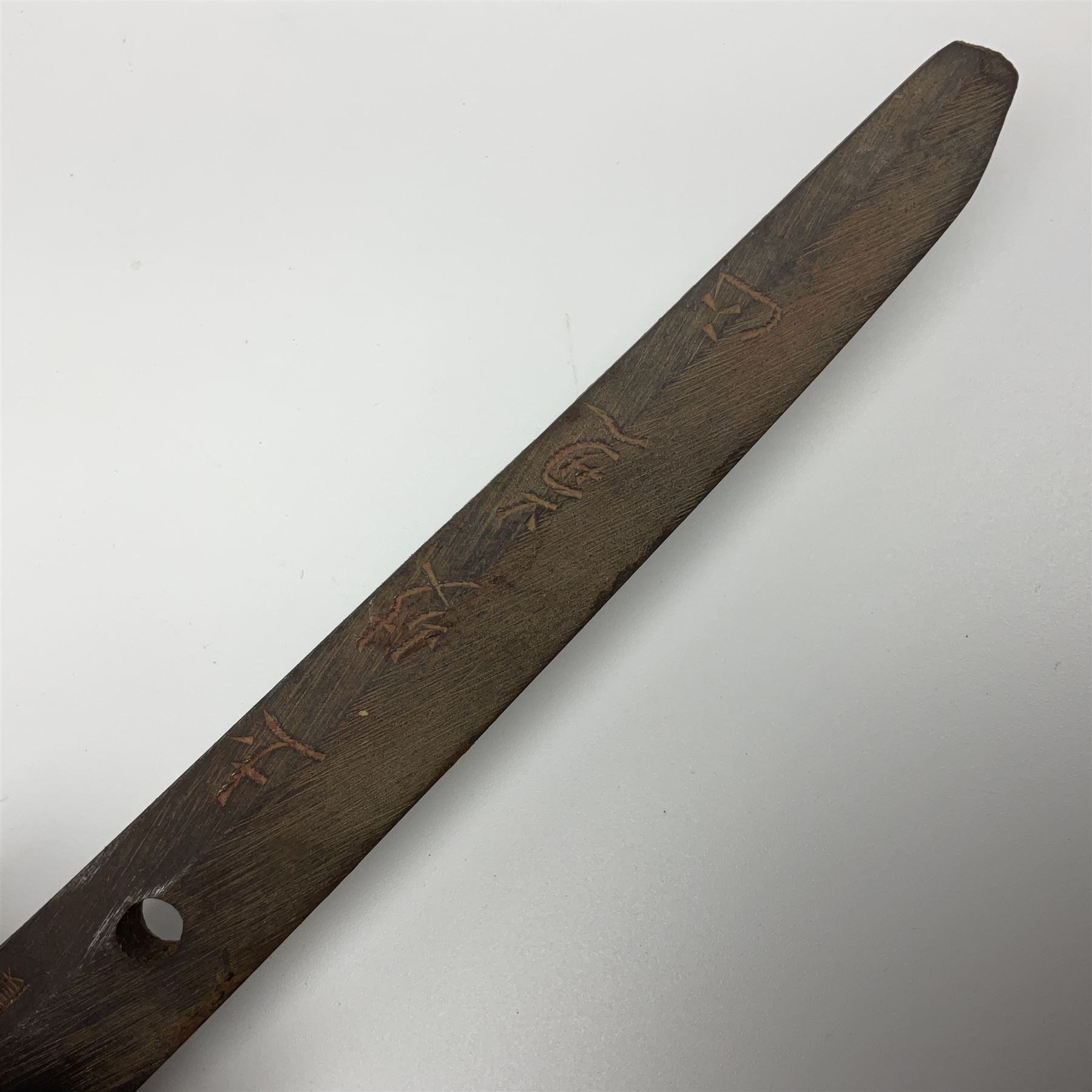 WW2 Japanese Army officer's shin gunto/katana sword with 67cm steel single edged blade, foliate cast brass tsuba, bound fish-skin grip with brass mounts, inscribed and painted marks to tang; in lacquered wooden scabbard with leather combat covering bearing four character marks L99cm overall