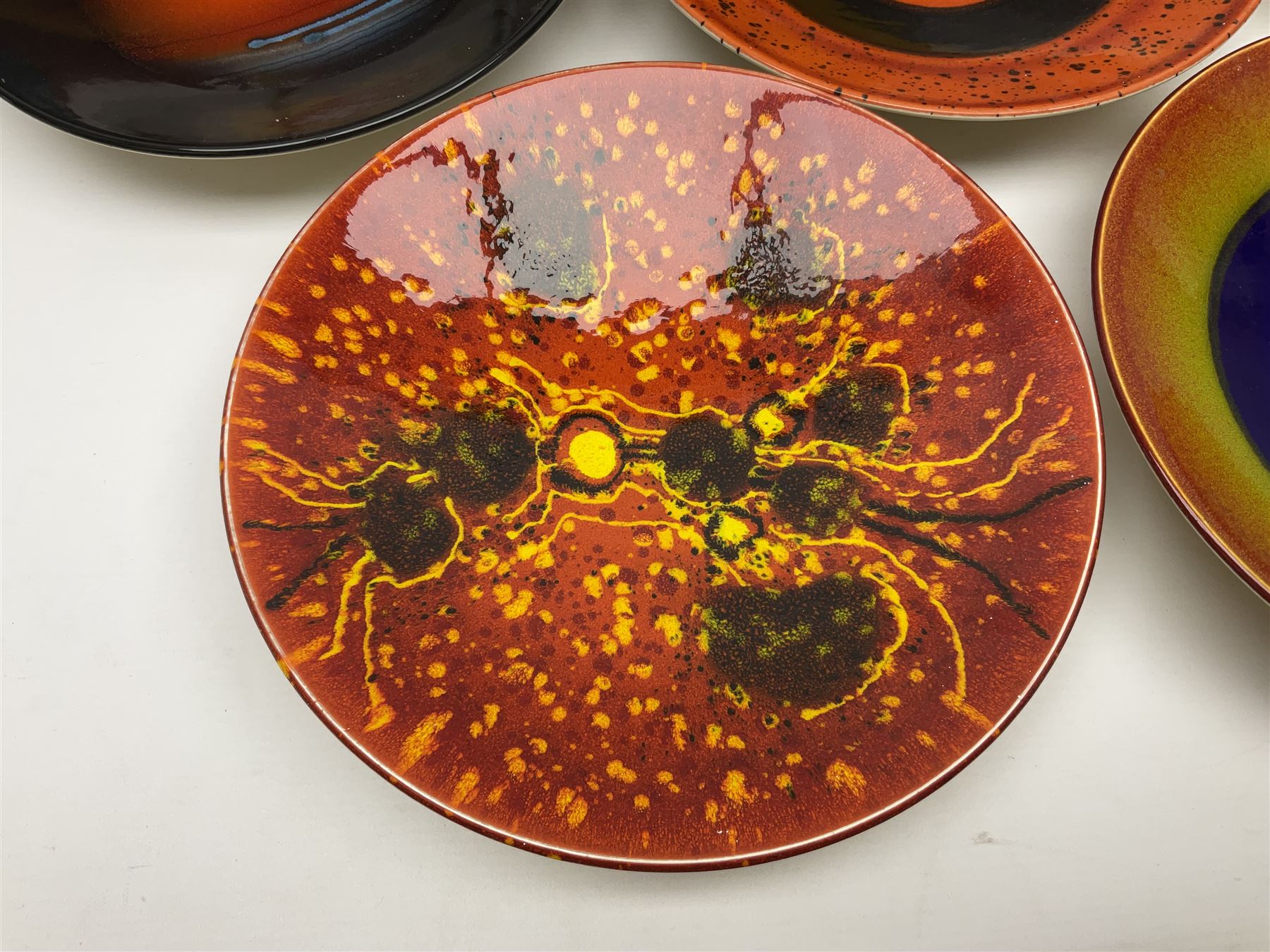 Poole Pottery The Planets, set of nine chargers 'The Planets, by Alan Clarke, comprising Mars, Mercury, Neptune, Venus, Uranus, Pluto, Jupiter, Saturn and Earth, all with original boxes and certificate, D27cm 